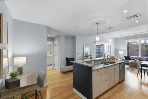 a kitchen with counter top space sink and center island