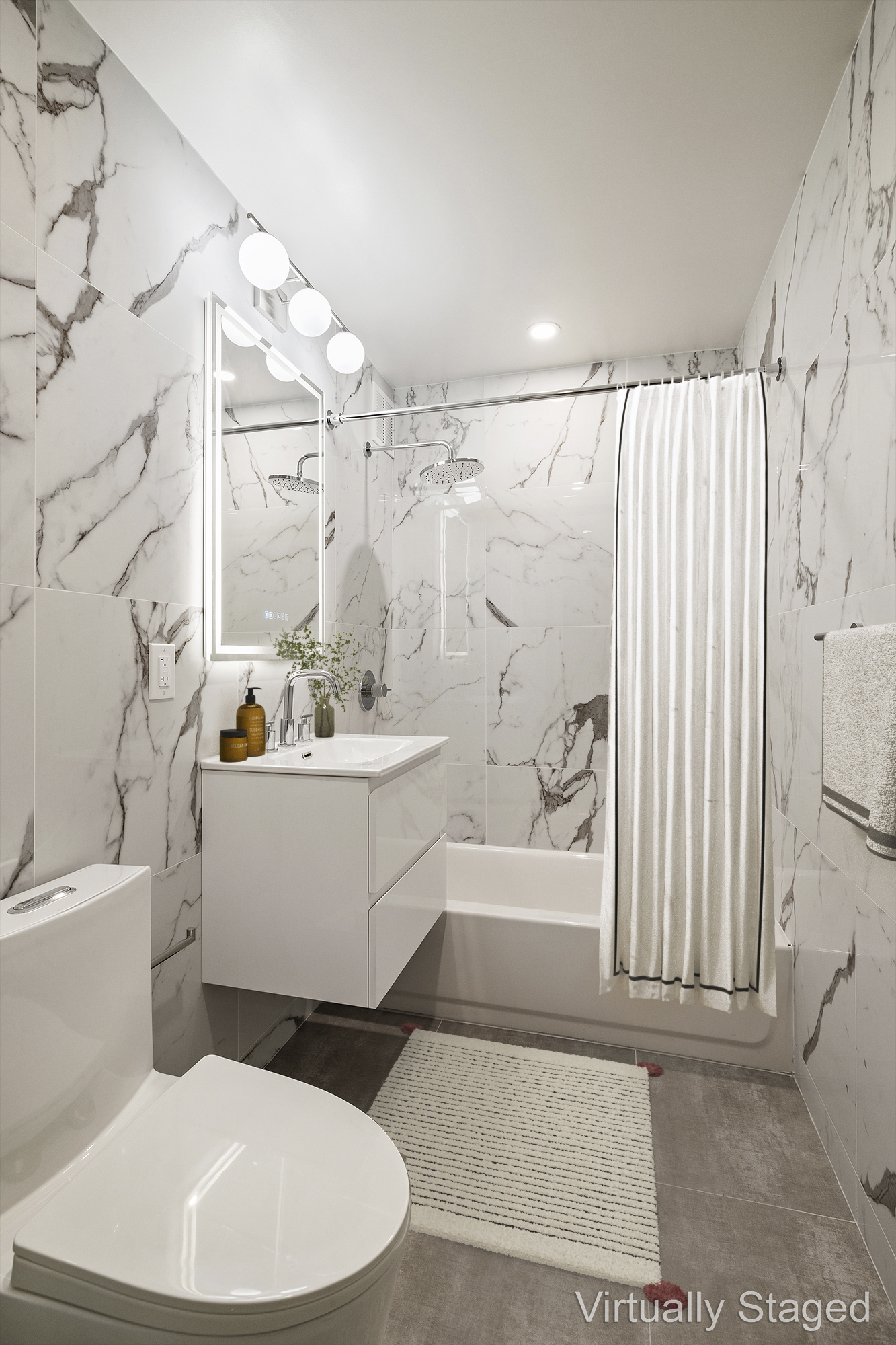 194 East 2nd Street, Unit 4A Manhattan, NY 10009 - Photo 4 of 13 a bathroom with a sink a toilet and bathtub