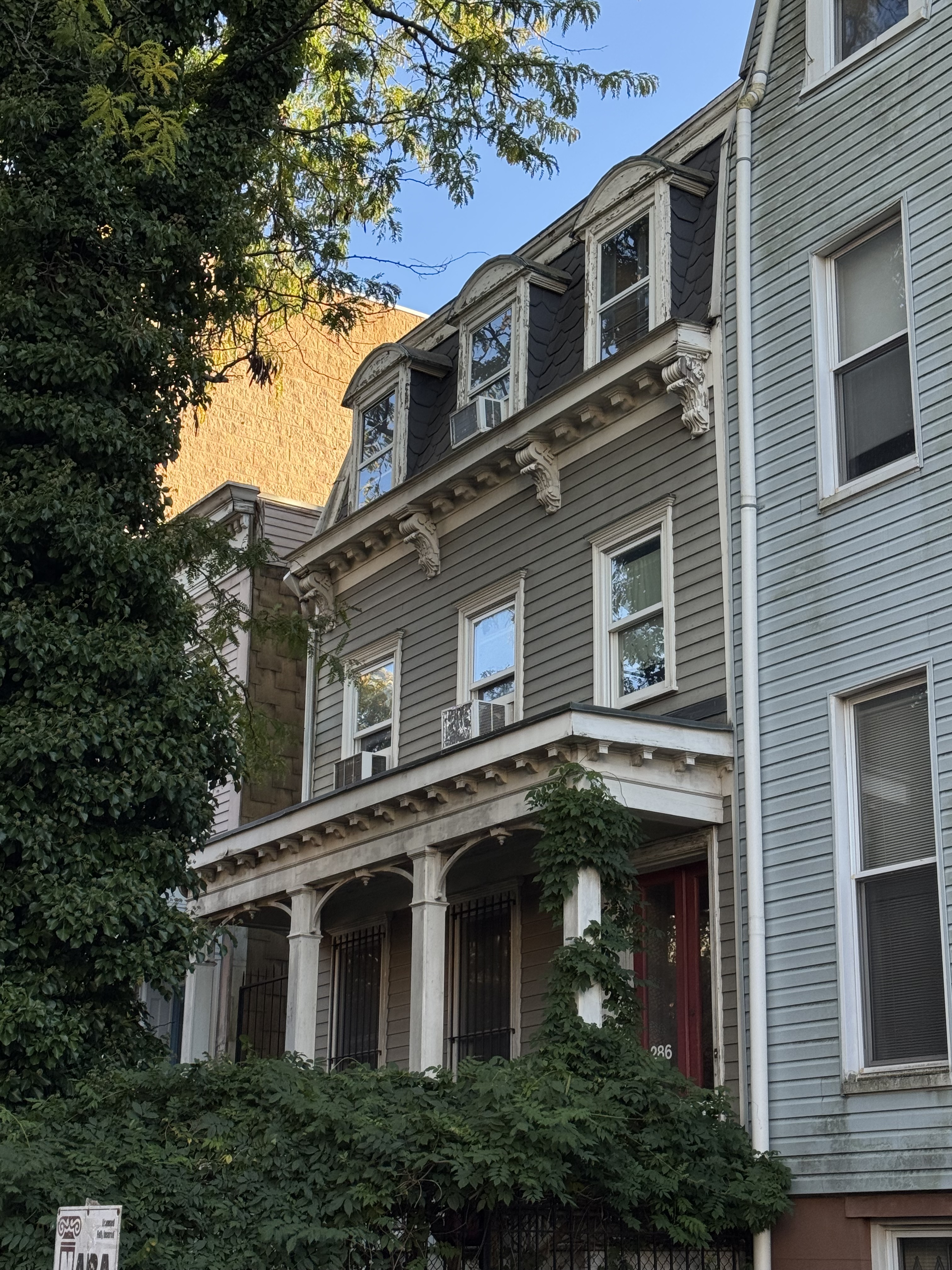 286 13th Street Brooklyn, NY 11215 - Photo 2 of 2 a front view of a house with plants and trees
