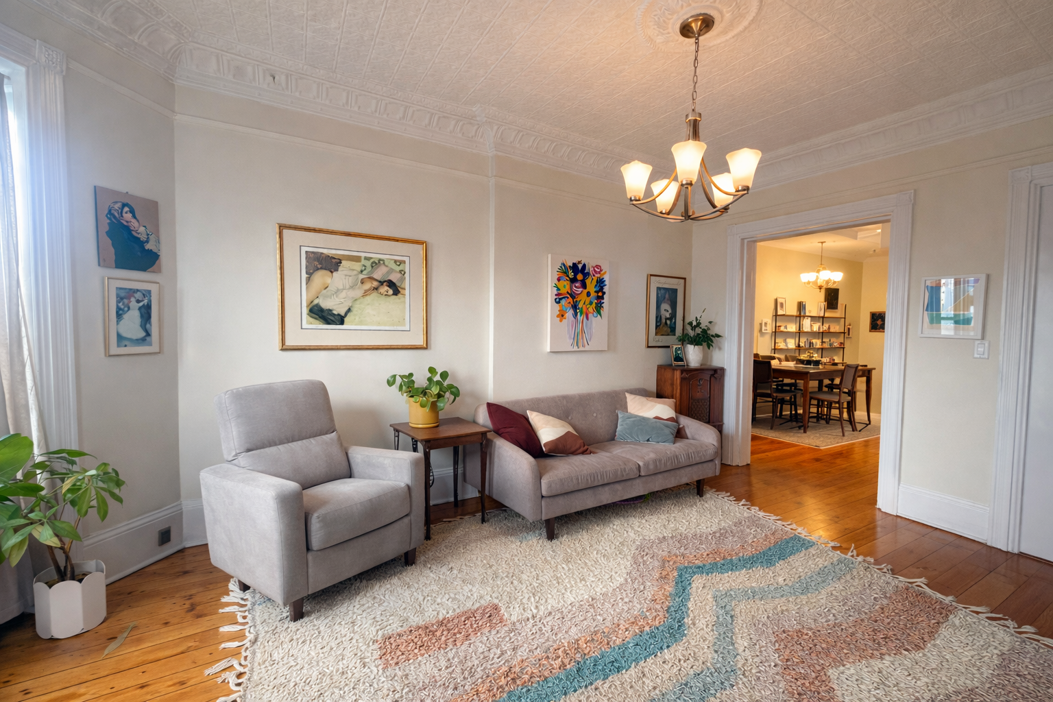 481 9th Street, Unit 4 Brooklyn, NY 11215 - Photo 3 of 33 a living room with furniture a chandelier and a painting on the wall