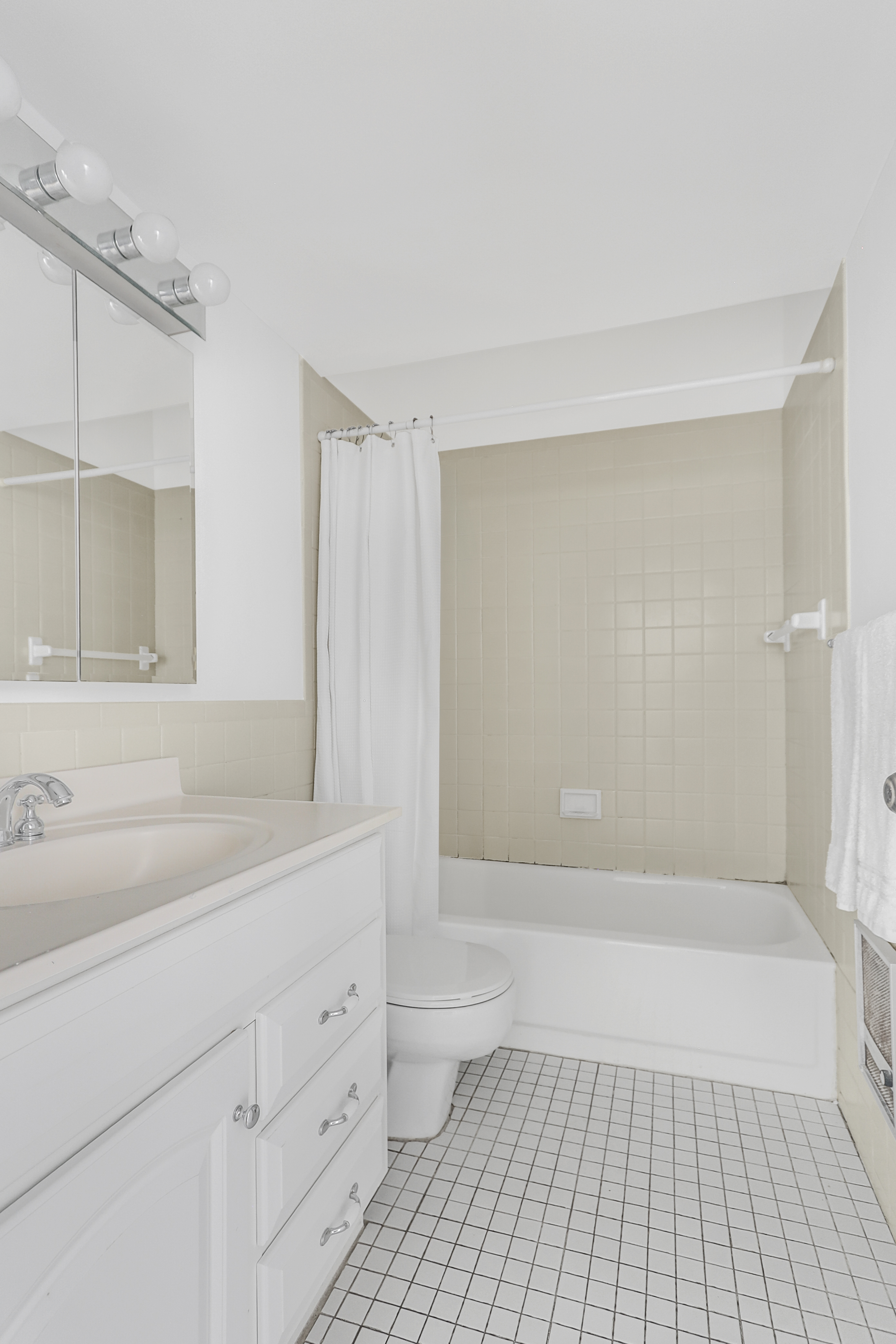 314 West 94th Street, Unit 5D Manhattan, NY 10025 - Photo 9 of 13 a bathroom with a sink a toilet and shower