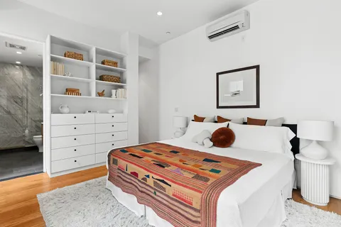 a bedroom with a bed and closet