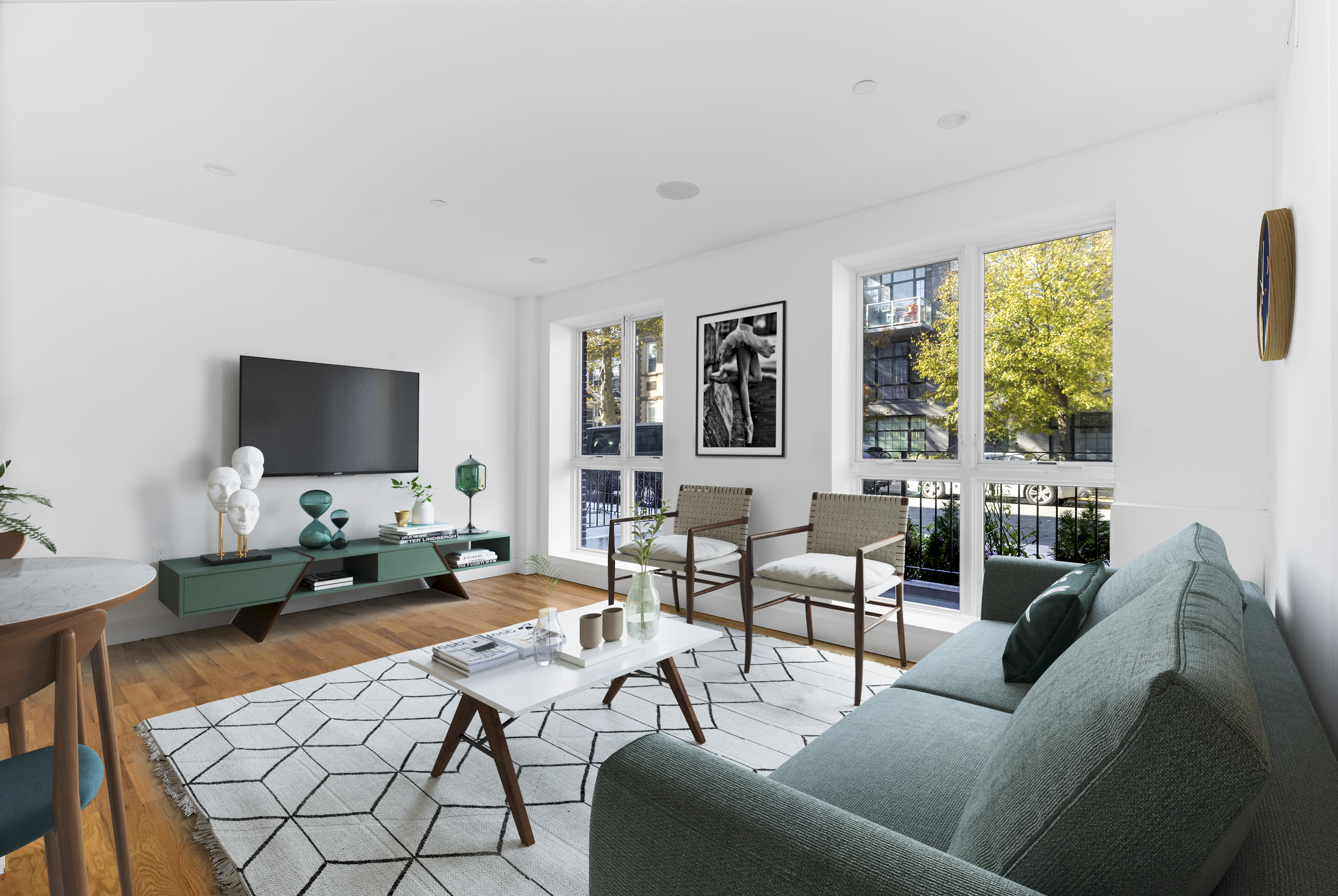 a living room with furniture and a flat screen tv