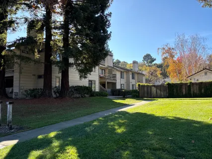 a view of a house with swimming pool and yard