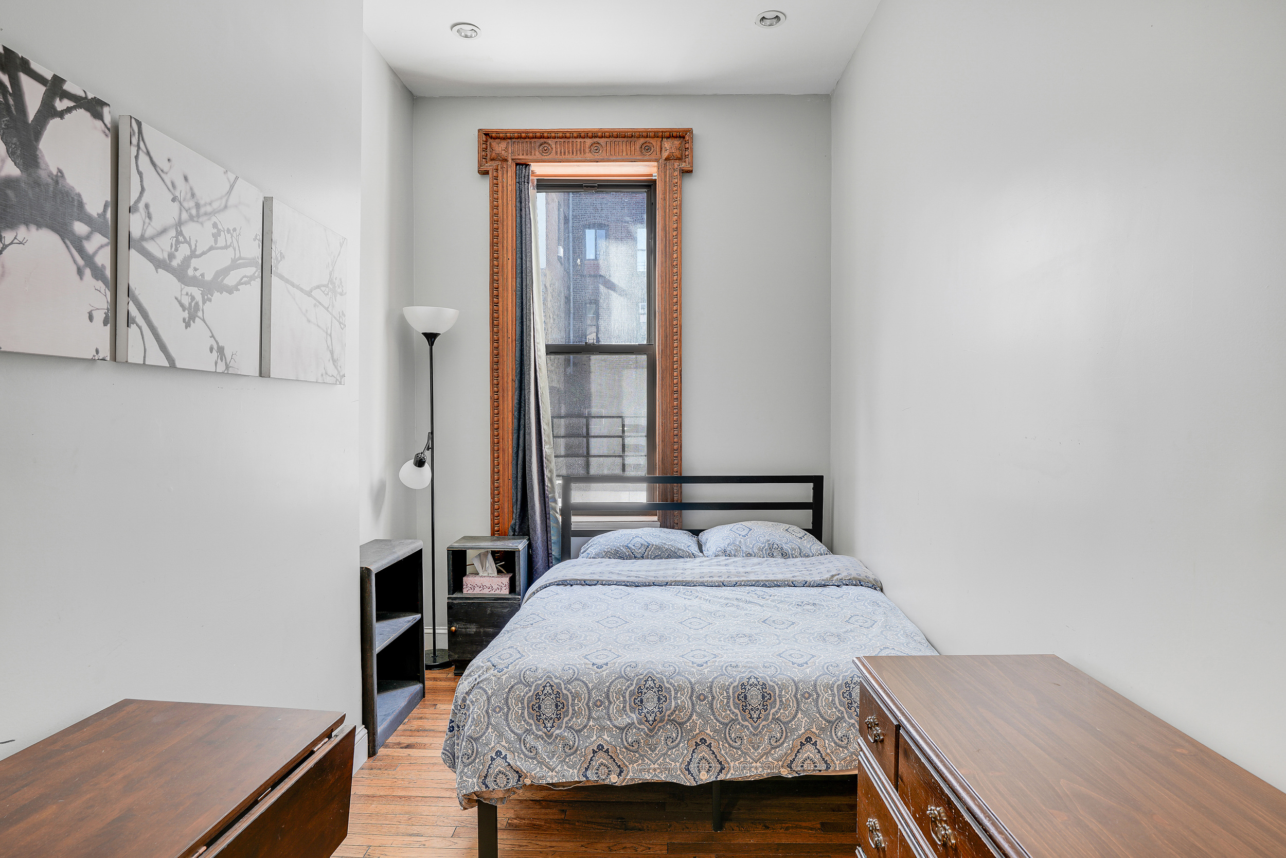 205 Edgecombe Avenue Manhattan, NY 10030 - Photo 12 of 21 a bedroom with a bed and a window