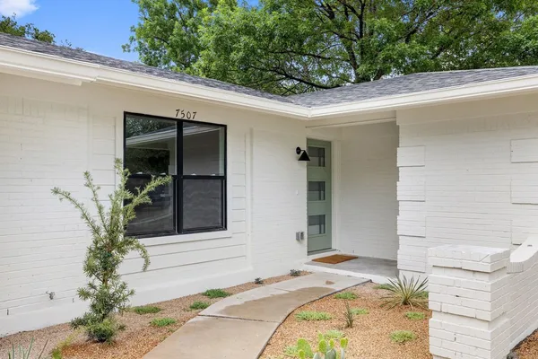 a house with a tree in front