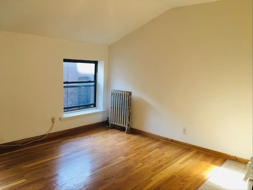16 Abingdon Square, Unit 4C Manhattan, NY 10014 - Photo 4 of 5 a view of an empty room and window