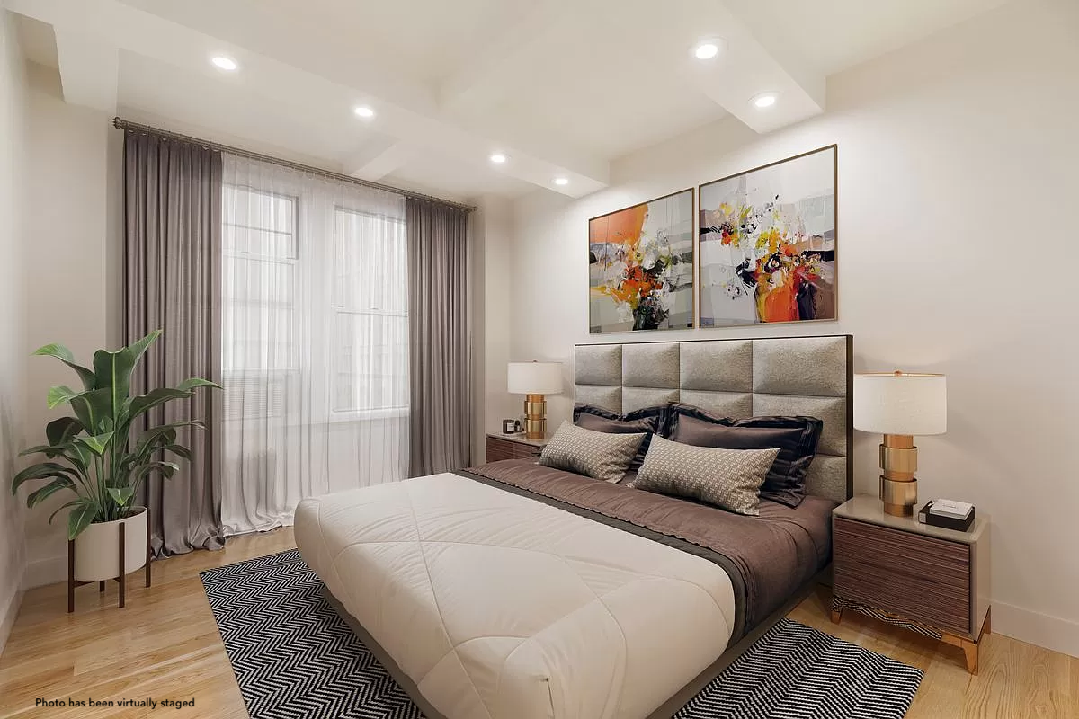 66 Madison Avenue, Unit 3BC Manhattan, NY 10016 - Photo 4 of 8 a bedroom with furniture and a painting on the wall