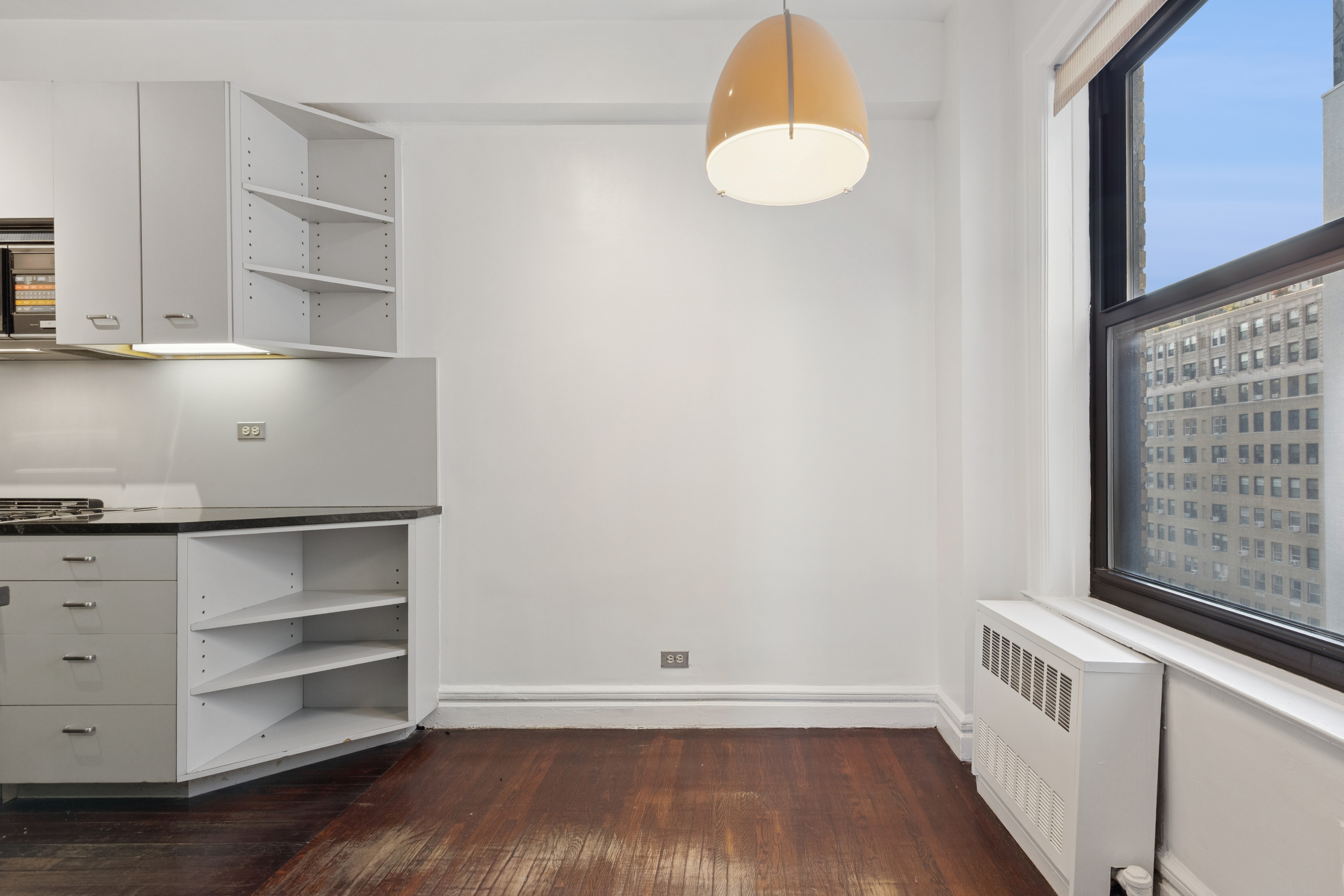 710 West End Avenue, Unit 14B Manhattan, NY 10025 - Photo 9 of 19 a view of cabinets and wooden floor