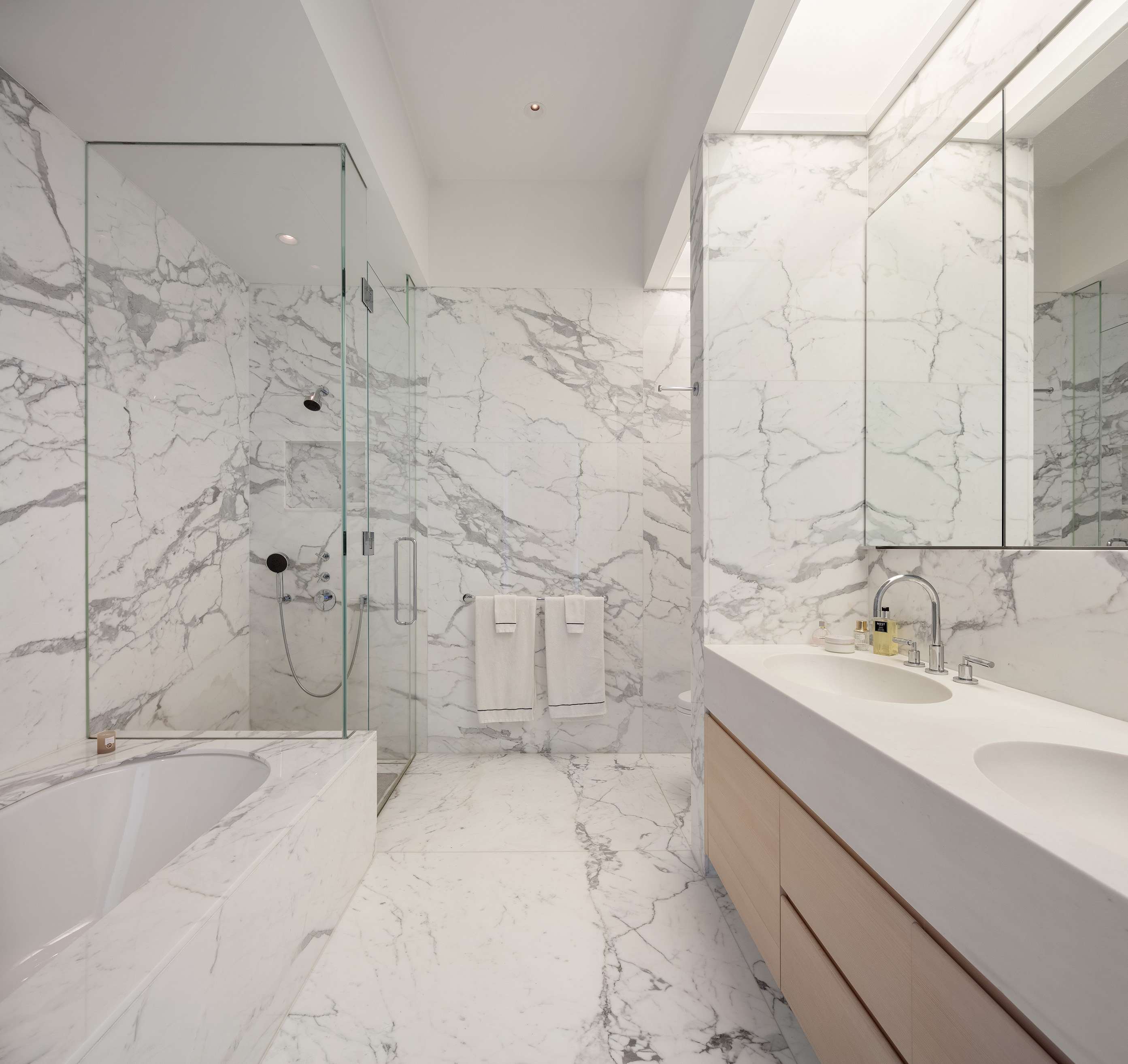 432 Park Avenue, Unit 81A Manhattan, NY 10022 - Photo 9 of 12 a bathroom with a bathtub and a sink