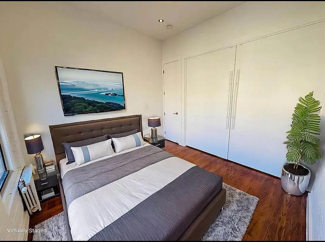 a kitchen with a refrigerator and a stove top oven