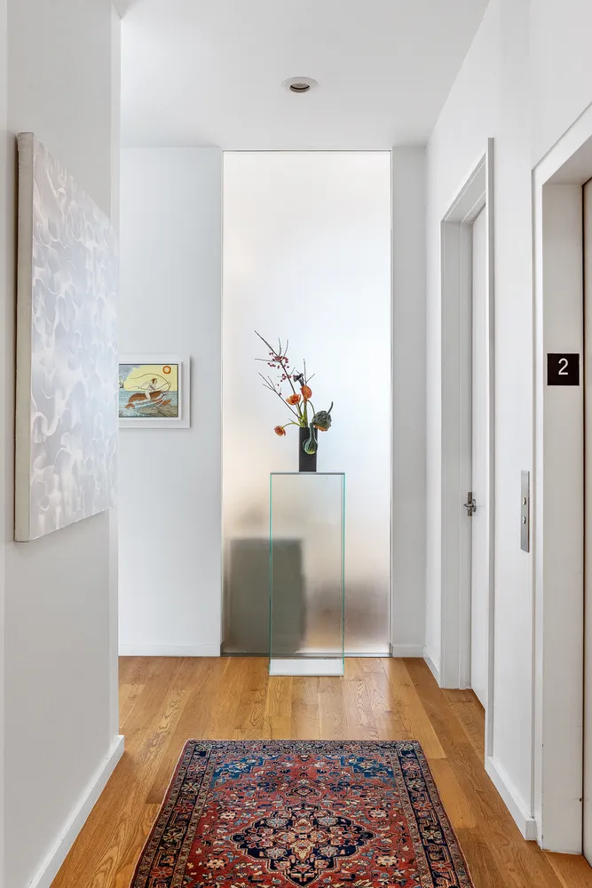 a view of en suite bathroom with wooden floor
