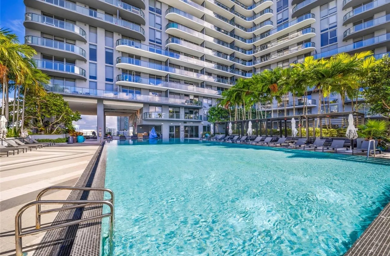 a view of a swimming pool with a patio