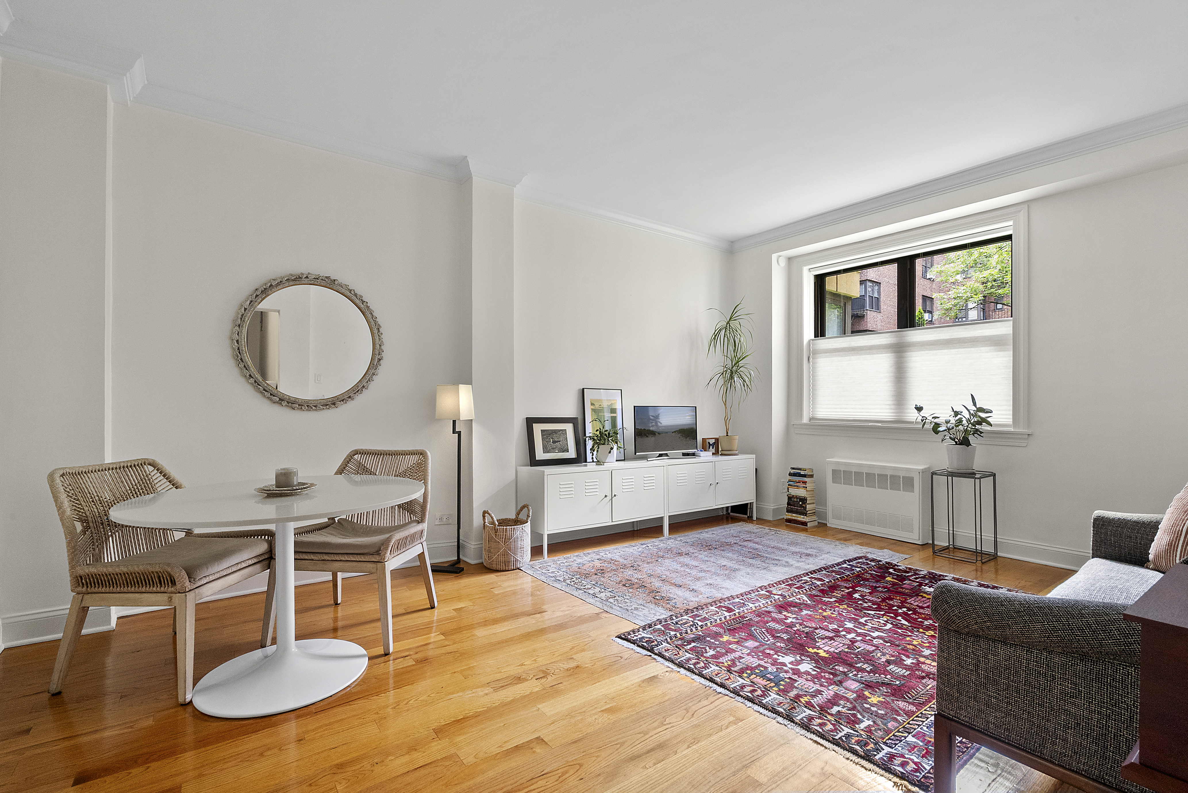 273 Bennett Avenue, Unit 3F Manhattan, NY 10040 - Photo 8 of 9 a living room with furniture a rug and a table