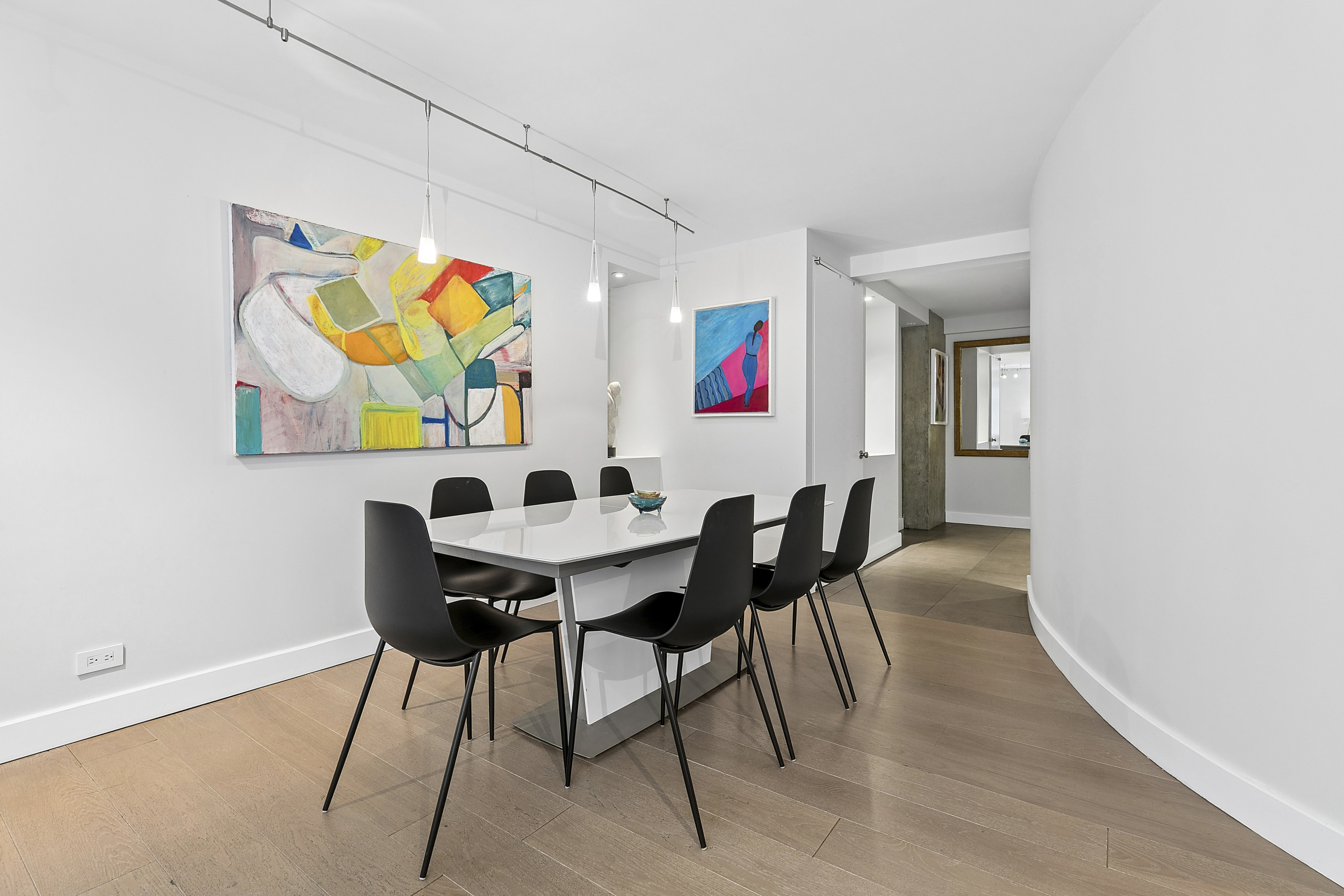 1065 Park Avenue, Unit 4BC Manhattan, NY 10128 - Photo 5 of 16 a view of a dining room with furniture and wooden floor