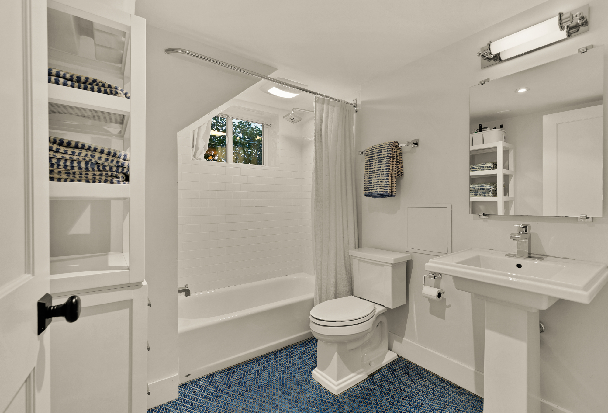 6815 Delaware Street Chevy Chase, MD 20815 - Photo 25 of 34 a bathroom with a toilet sink and shower