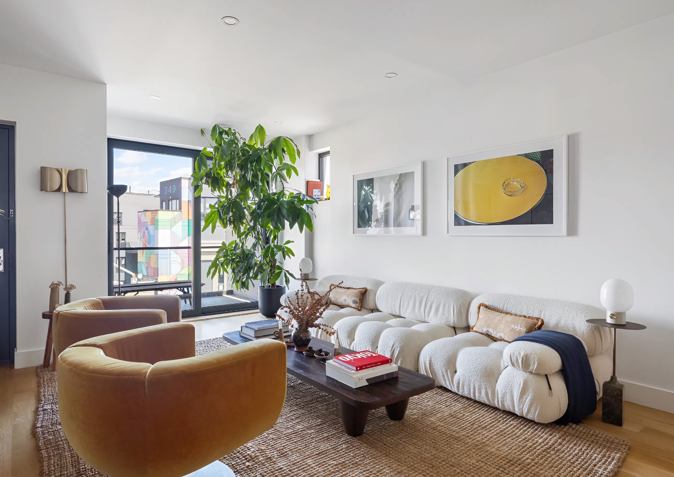 340 Metropolitan Avenue, Unit PHB Brooklyn, NY 11211 - Photo 4 of 18 a living room with furniture window and a potted plant