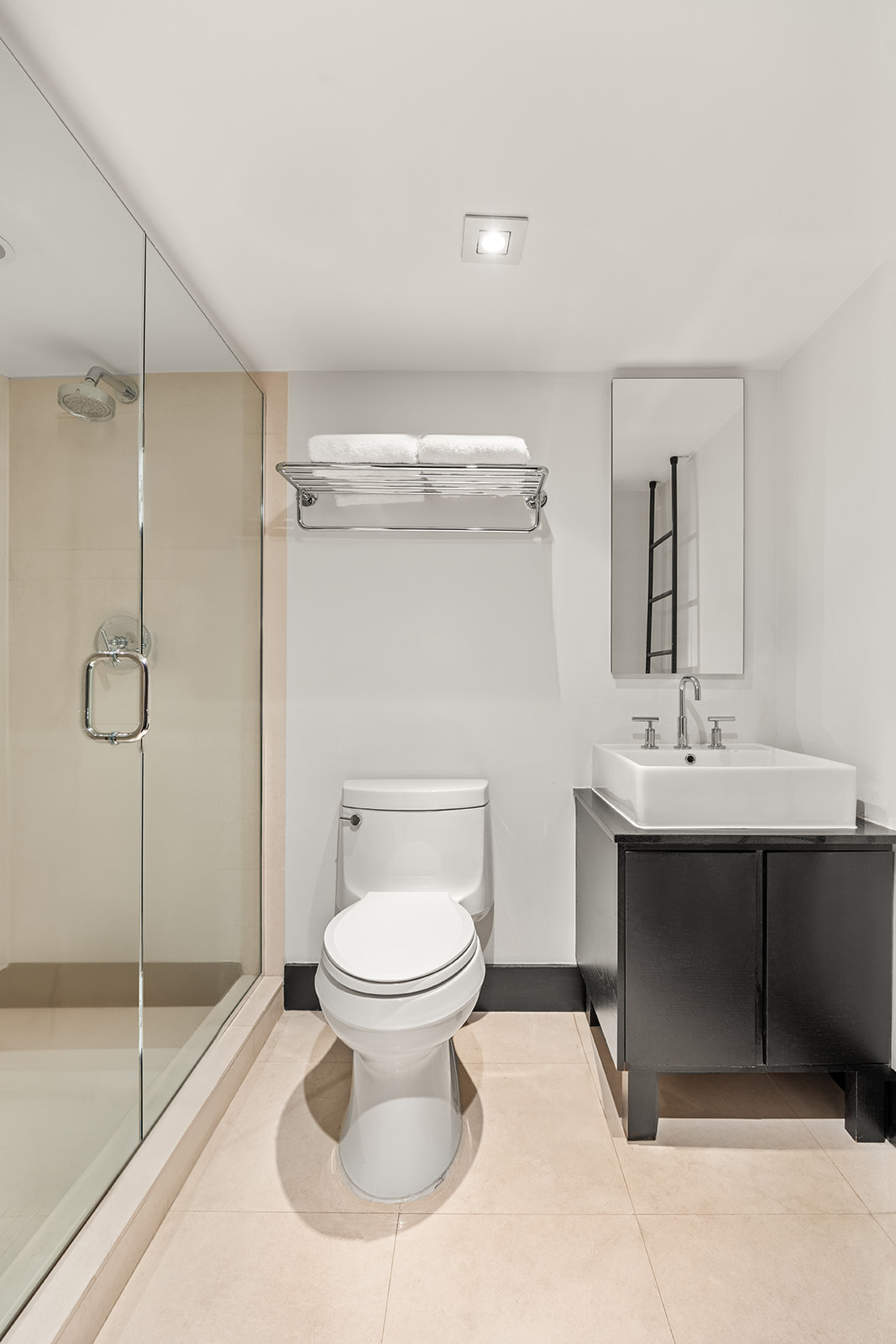 254 Park Avenue South, Unit 4K Manhattan, NY 10010 - Photo 6 of 10 a bathroom with a sink toilet and shower