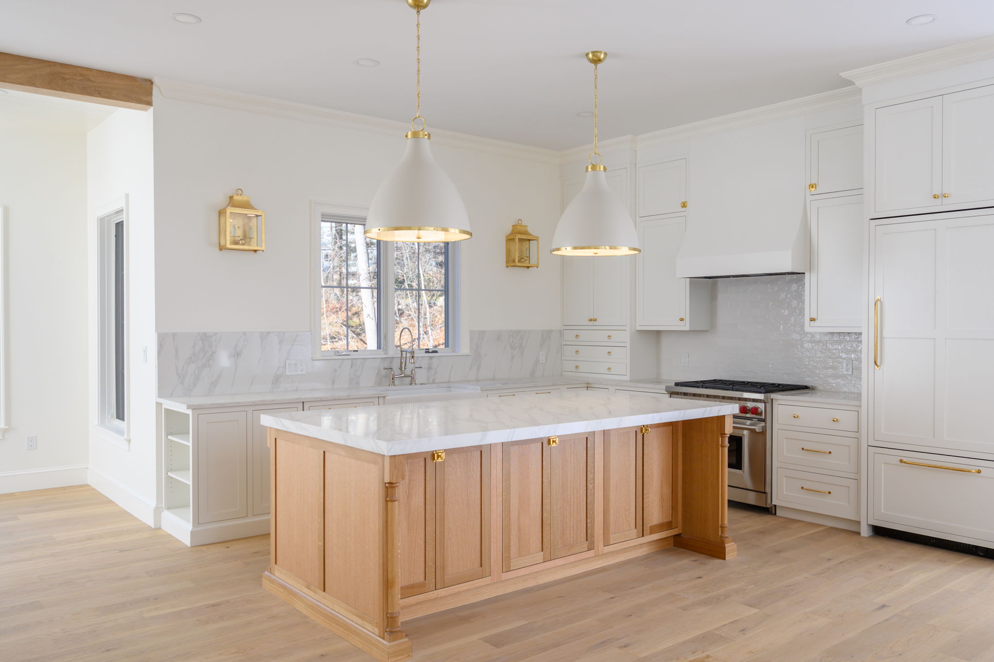 249 Central Avenue Milton, MA 02186 - Photo 11 of 61 a kitchen with stainless steel appliances granite countertop a sink a stove a refrigerator and island with wooden floor