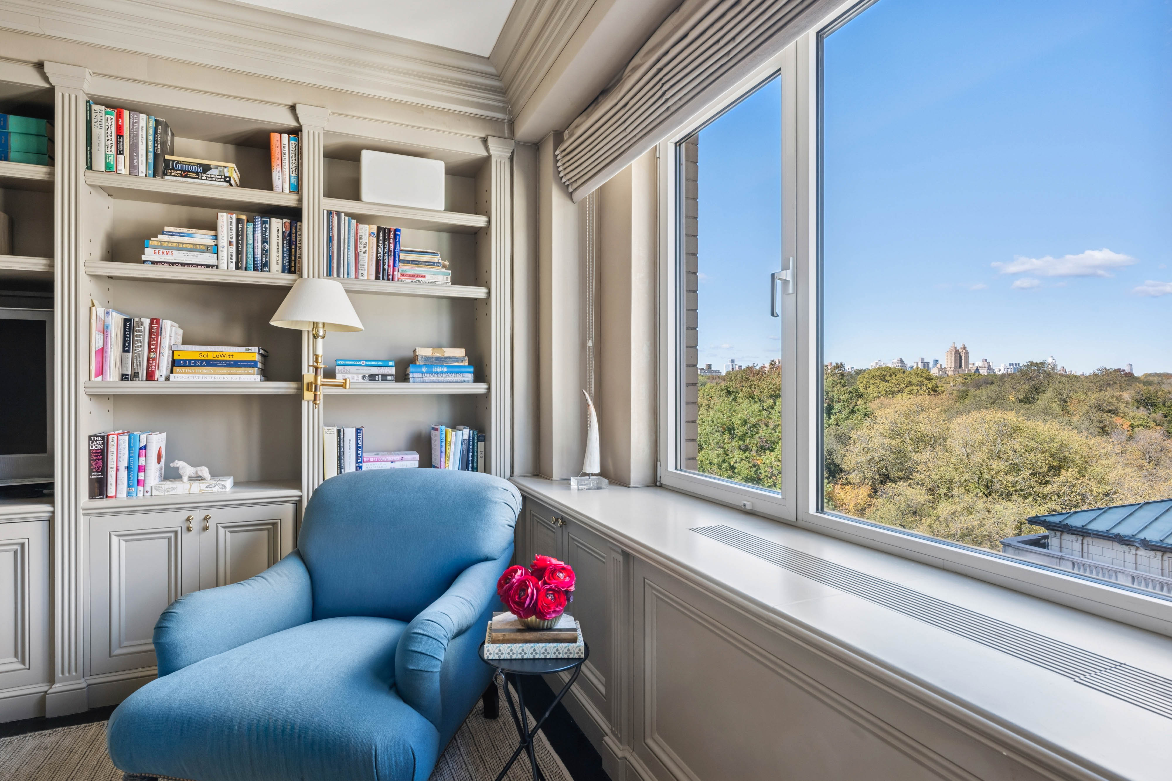 936 5th Avenue, Unit 10AB Manhattan, NY 10021 - Photo 9 of 37 a living room with furniture and a floor to ceiling window or shelf