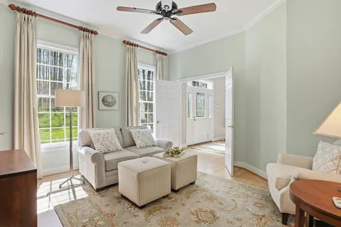 a spacious bedroom with a bed a couch and dresser