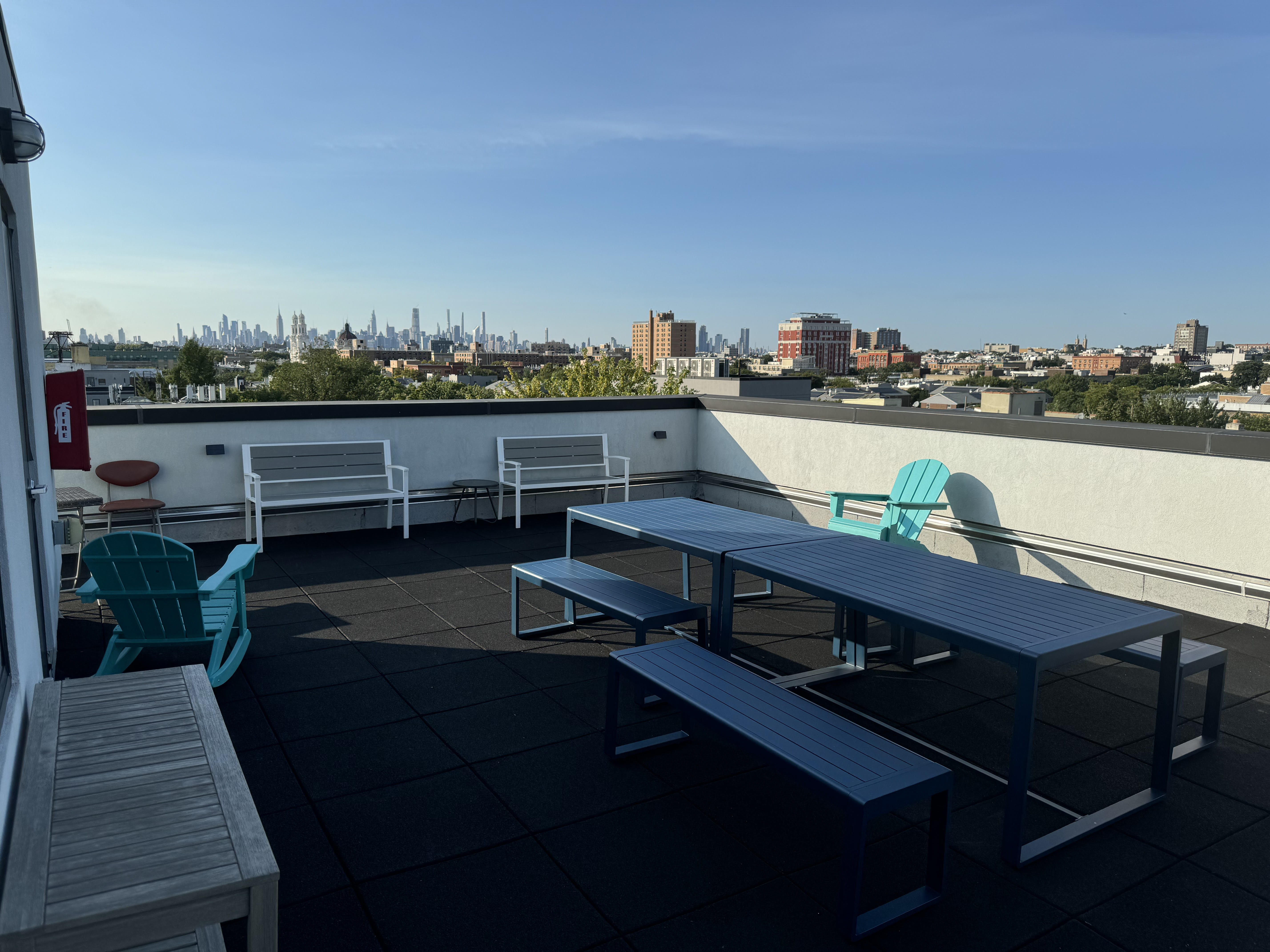 1229 Putnam Avenue, Unit 2D Brooklyn, NY 11221 - Photo 1 of 9 a view of a balcony with chairs and a table