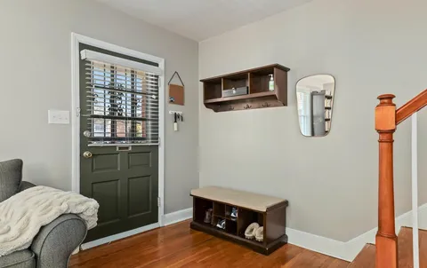 a room with a bed and a mirror