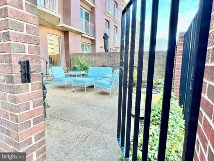 a view of a balcony with a floor to ceiling window