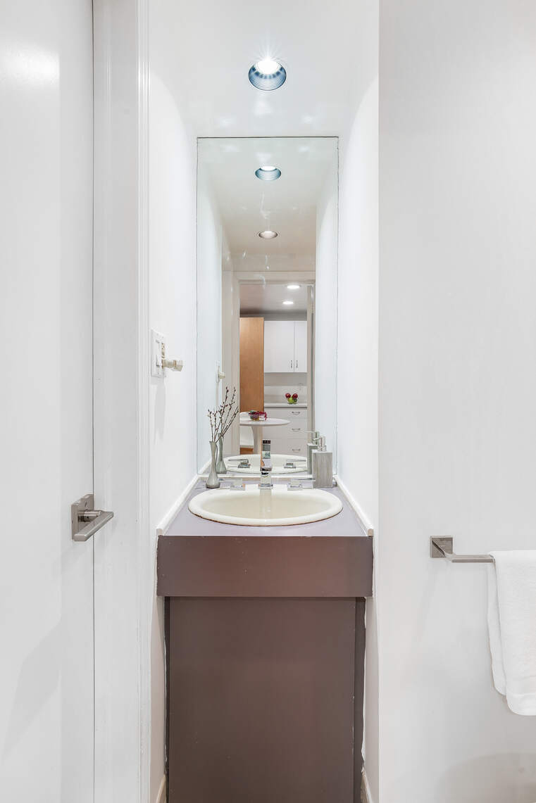 92 Remsen Street, Unit 1A Brooklyn, NY 11201 - Photo 8 of 12 a bathroom with a sink and a mirror