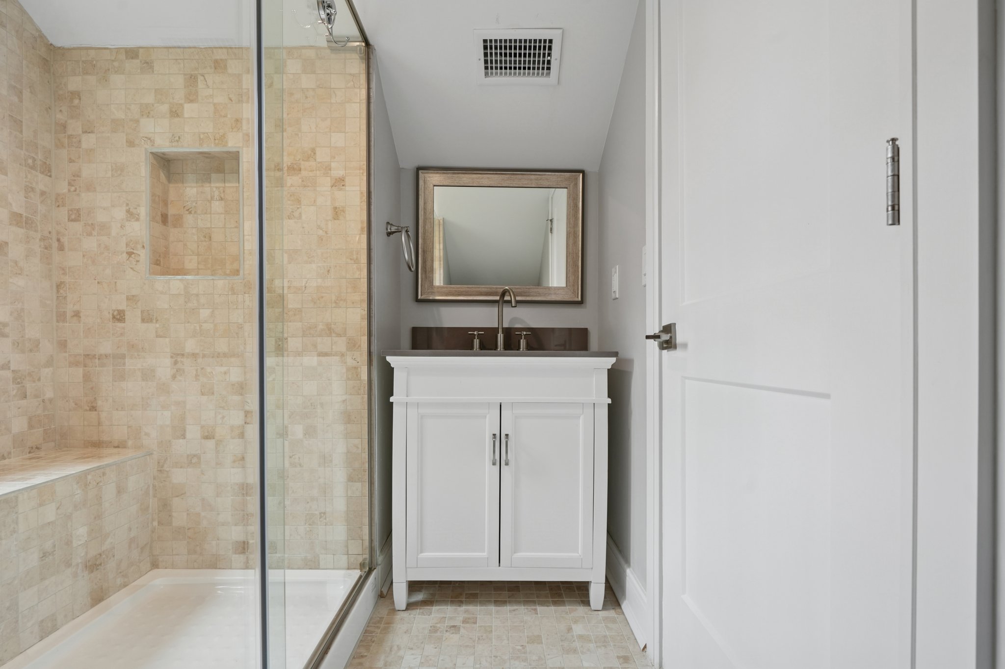 823 River Road Chatham, NJ 07928 - Photo 38 of 60 a bathroom with a sink a mirror and shower