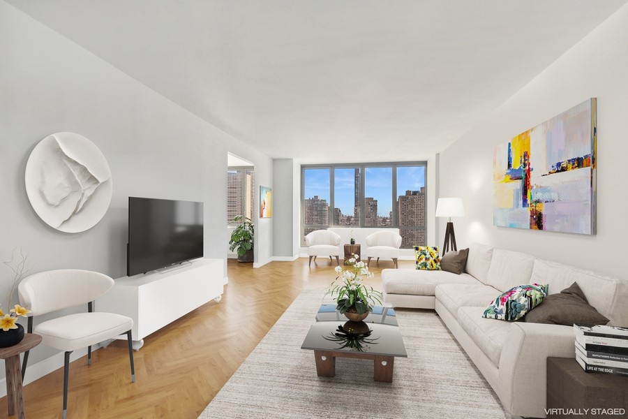 2 Columbus Avenue, Unit 23A Manhattan, NY 10019 - Photo 1 of 10 a living room with furniture rug and window