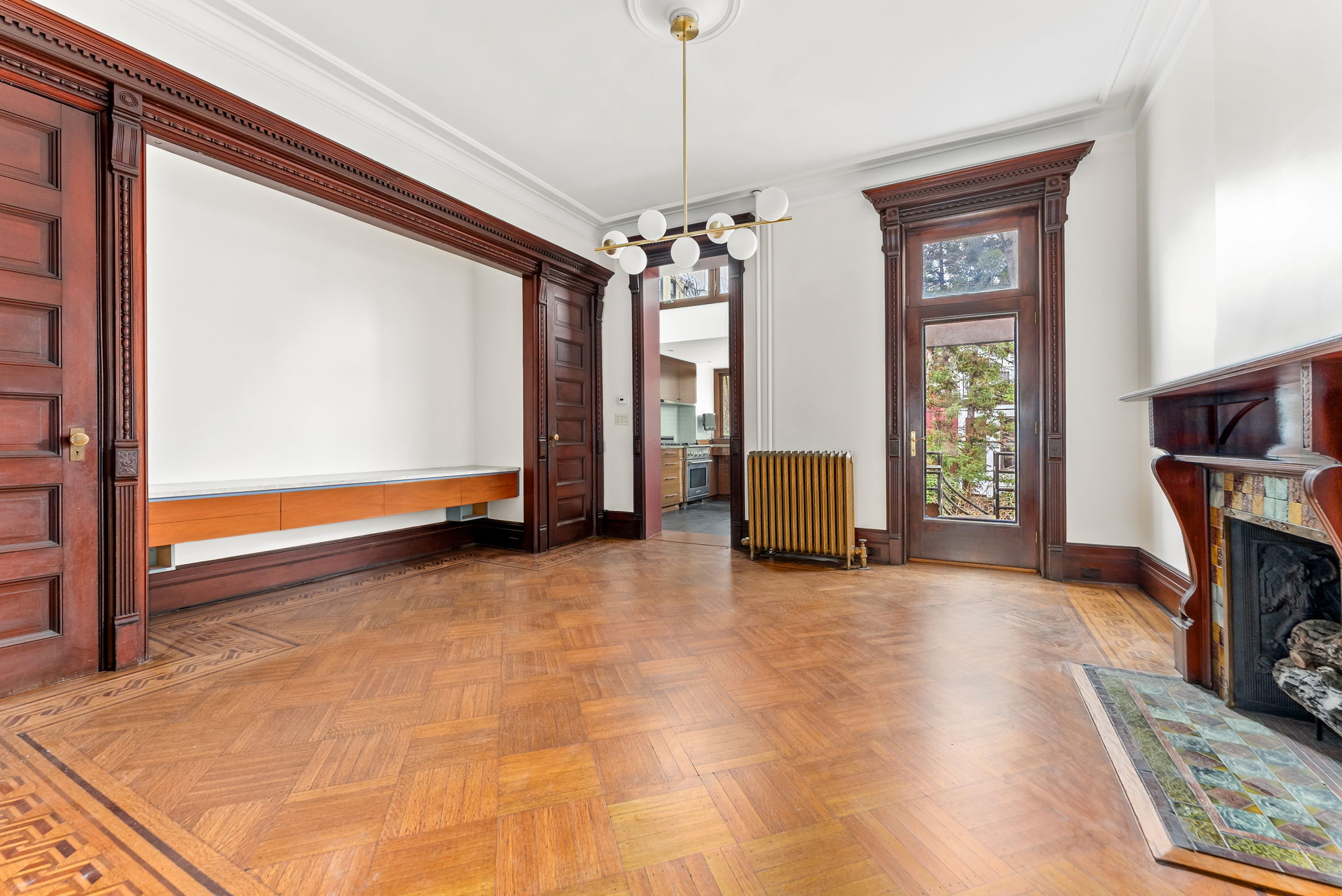 694 10th Street, Unit 2 Brooklyn, NY 11215 - Photo 5 of 22 a view of an empty room with window and hardwood floor