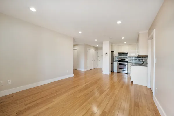 a view of kitchen with wooden floor