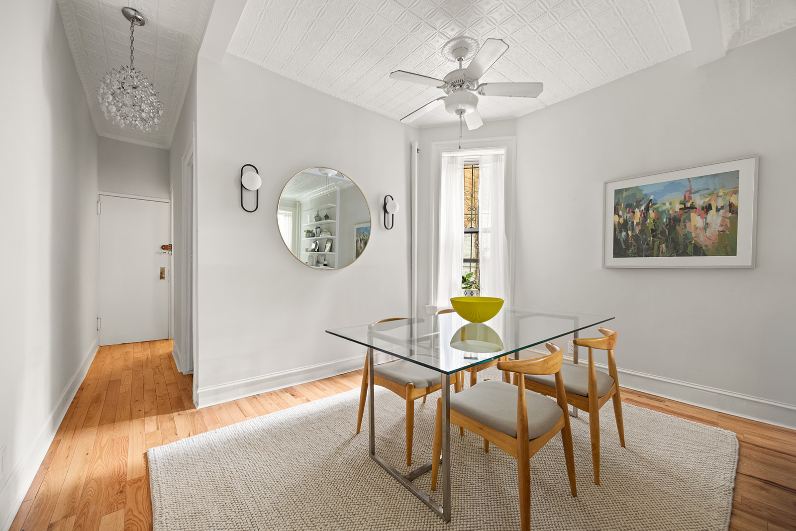 162 Garfield Place, Unit 1L Brooklyn, NY 11215 - Photo 4 of 13 a view of a dining room with furniture and a chandelier