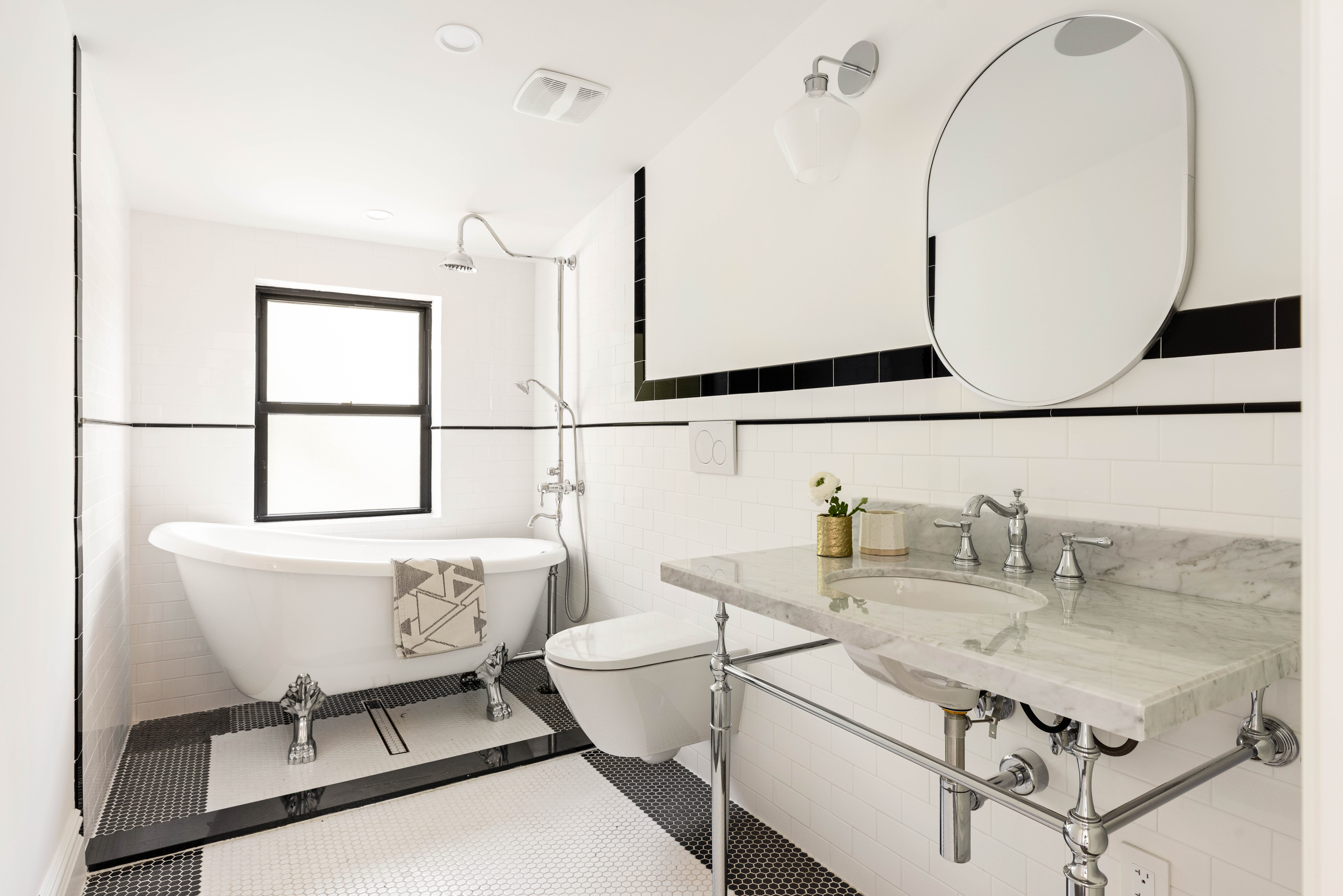 287 Midwood Street Brooklyn, NY 11225 - Photo 11 of 17 a bathroom with a sink mirror vanity and toilet