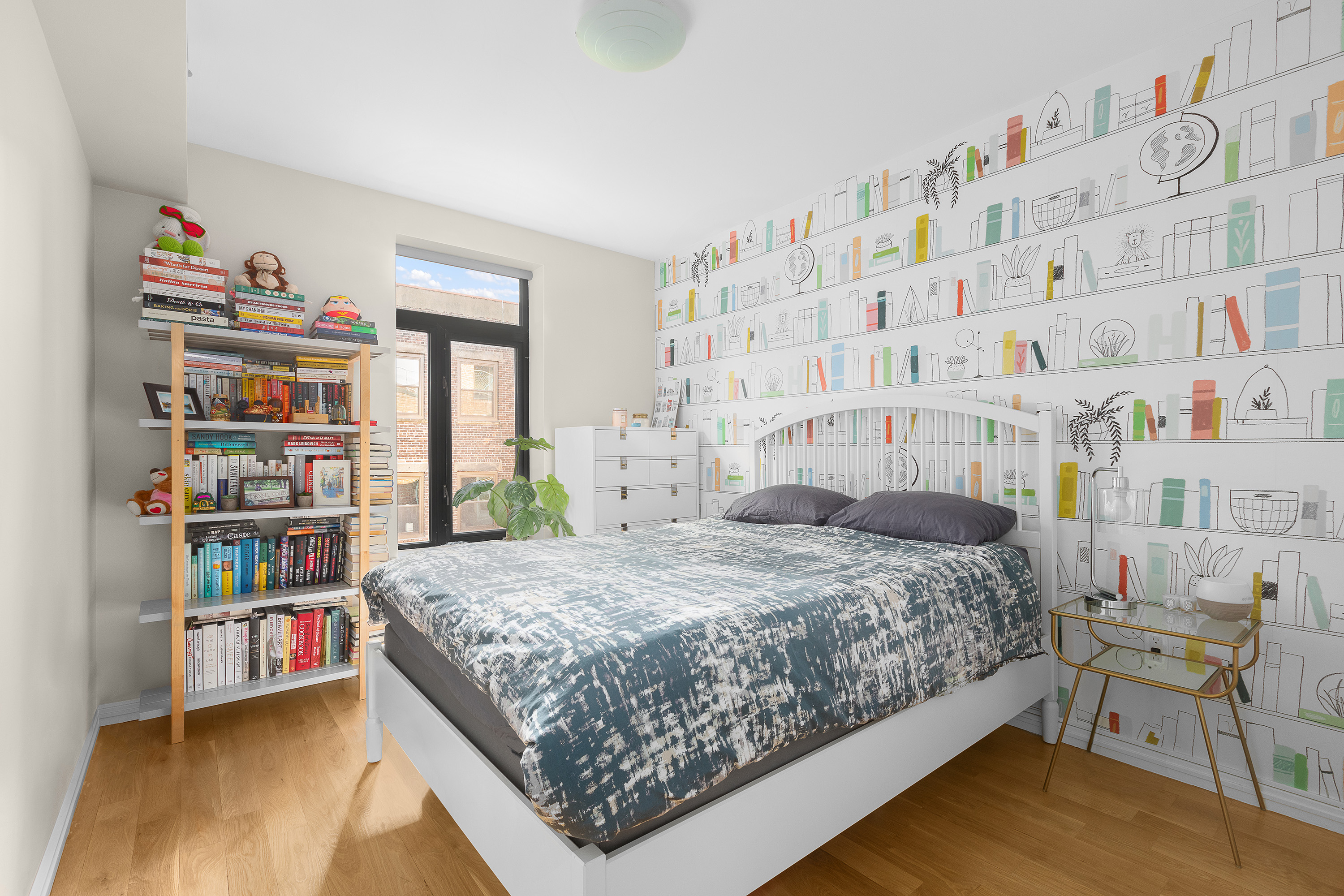 364 Lafayette Avenue, Unit 4A Brooklyn, NY 11238 - Photo 6 of 12 a bedroom with a bed and a book shelf