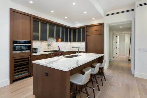 a kitchen with a table and chairs in it