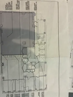 a couple of cars parked in front of buildings