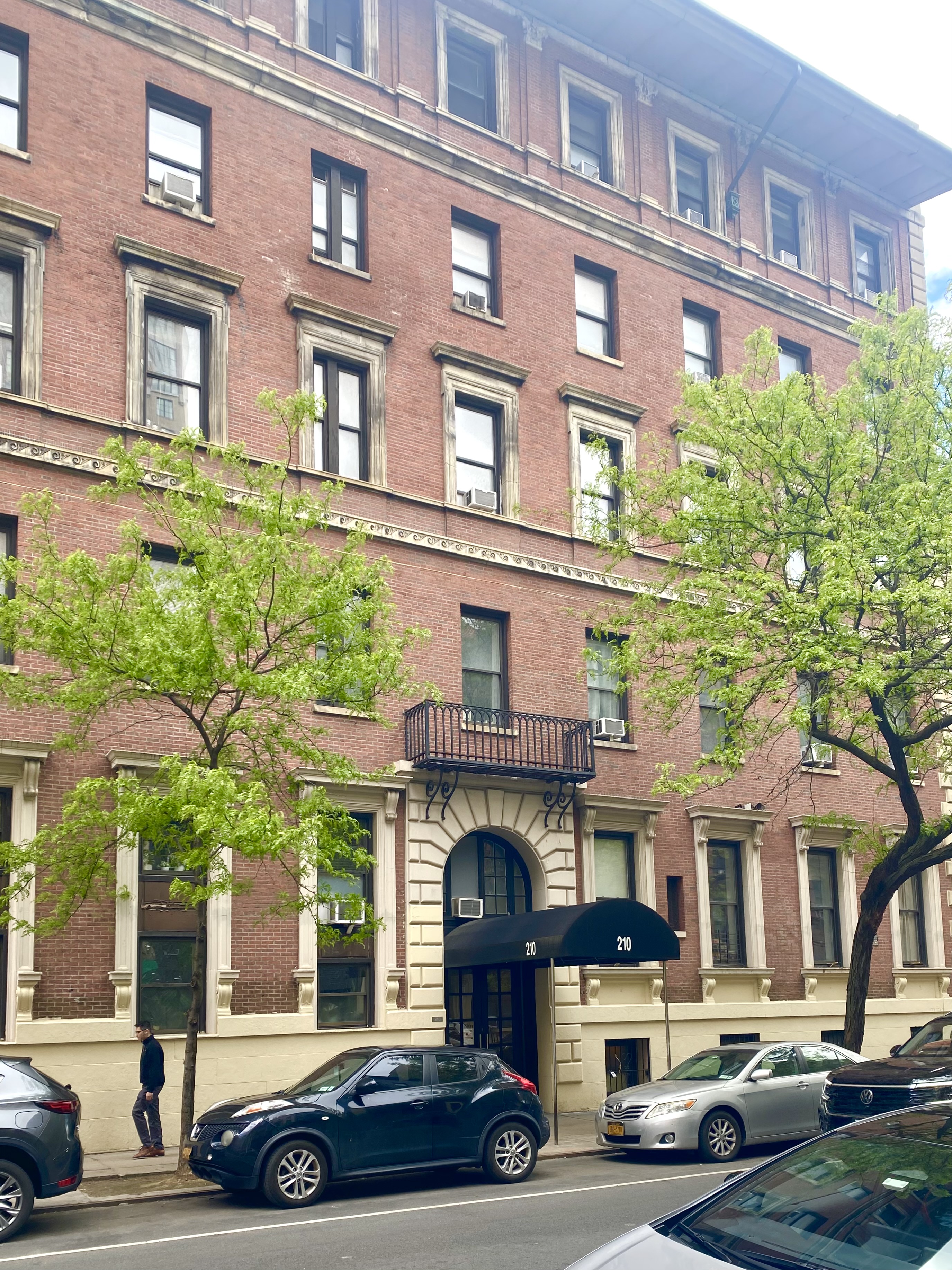 210 West 16th Street, Unit PH Manhattan, NY 10011 - Photo 15 of 16 a car parked in front of a building