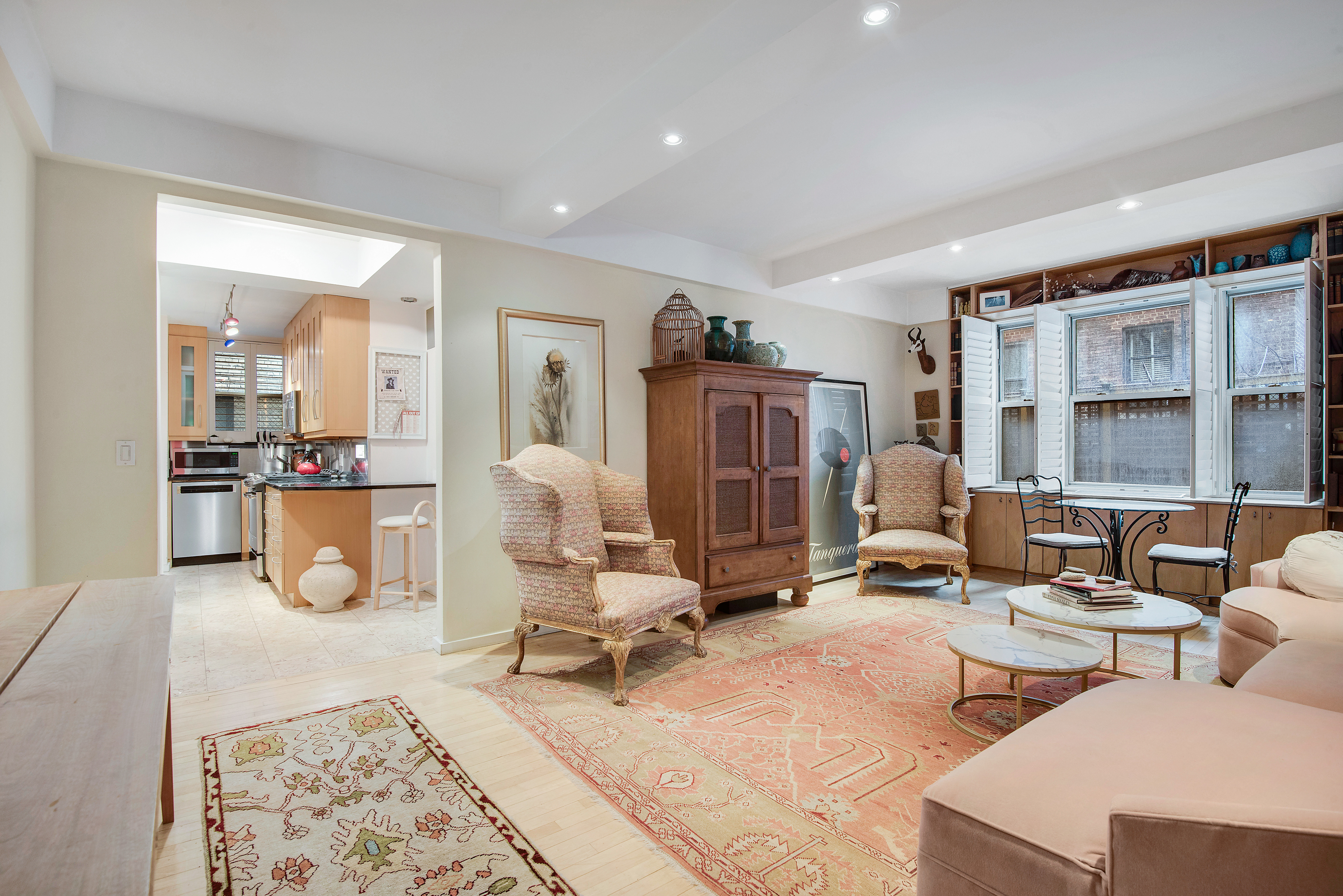 434 East 52nd Street, Unit 1BH Manhattan, NY 10022 - Photo 3 of 23 a living room with furniture gym and large window