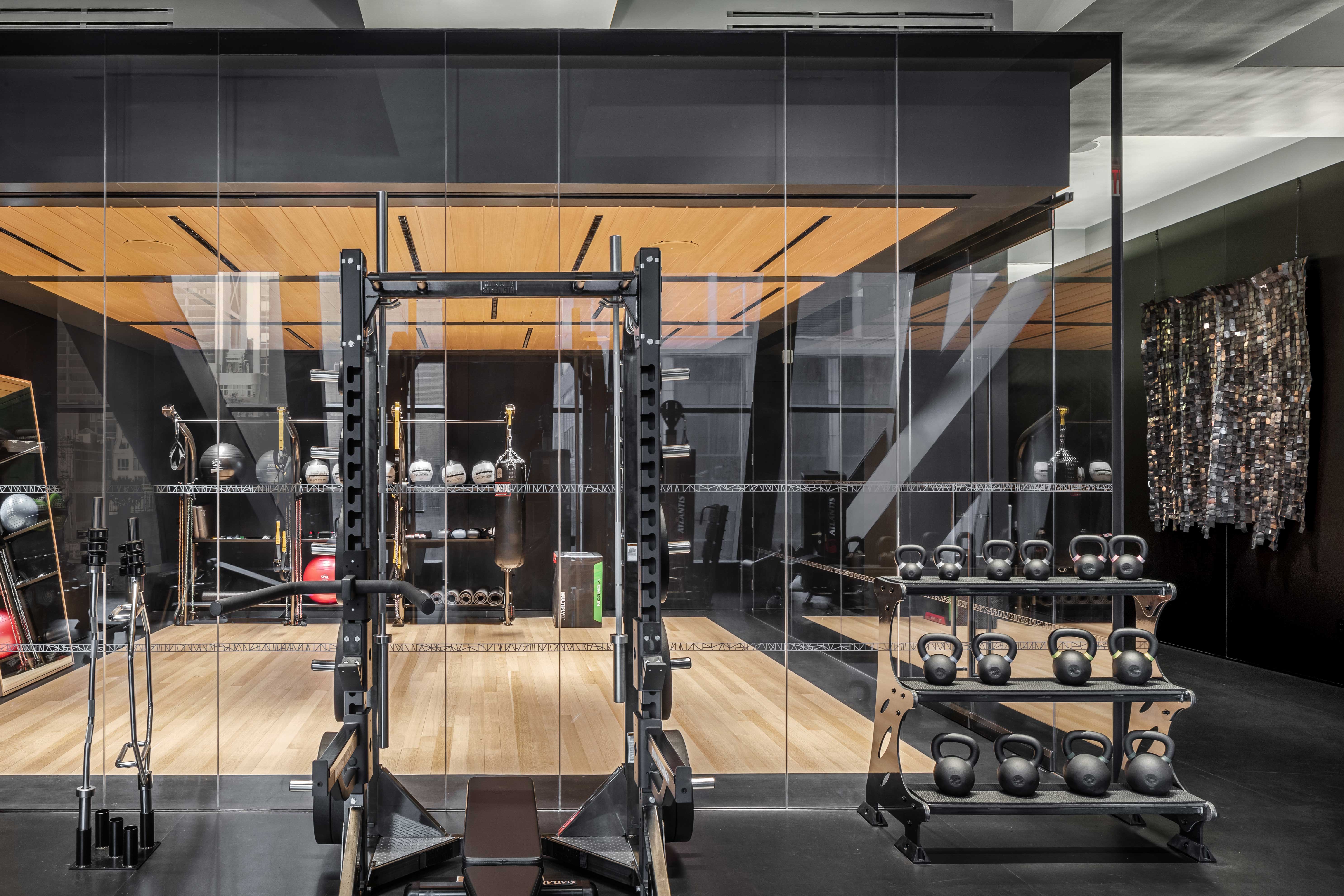 53 West 53rd Street, Unit 28D Manhattan, NY 10019 - Photo 9 of 22 a room with gym equipment