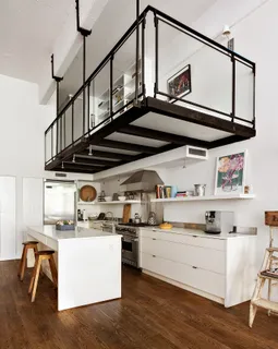 a view of kitchen with stainless steel appliances cabinets and wooden floor