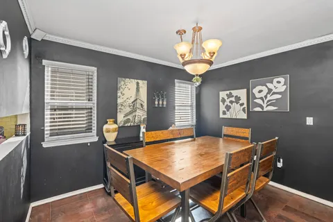a dining room with furniture and window