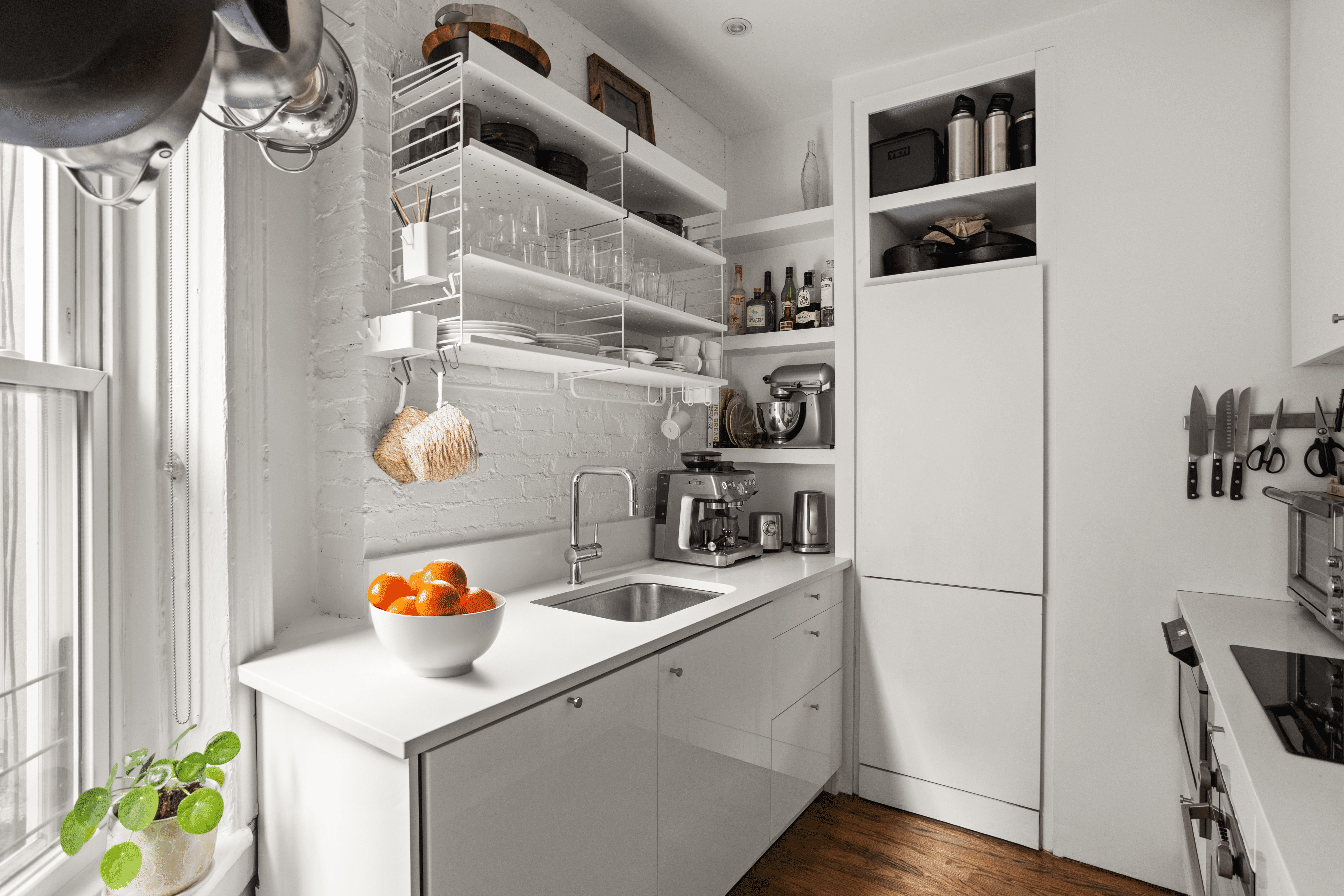 248 East 7th Street, Unit 19/20 Manhattan, NY 10009 - Photo 3 of 7 a storage room with washer and dryer