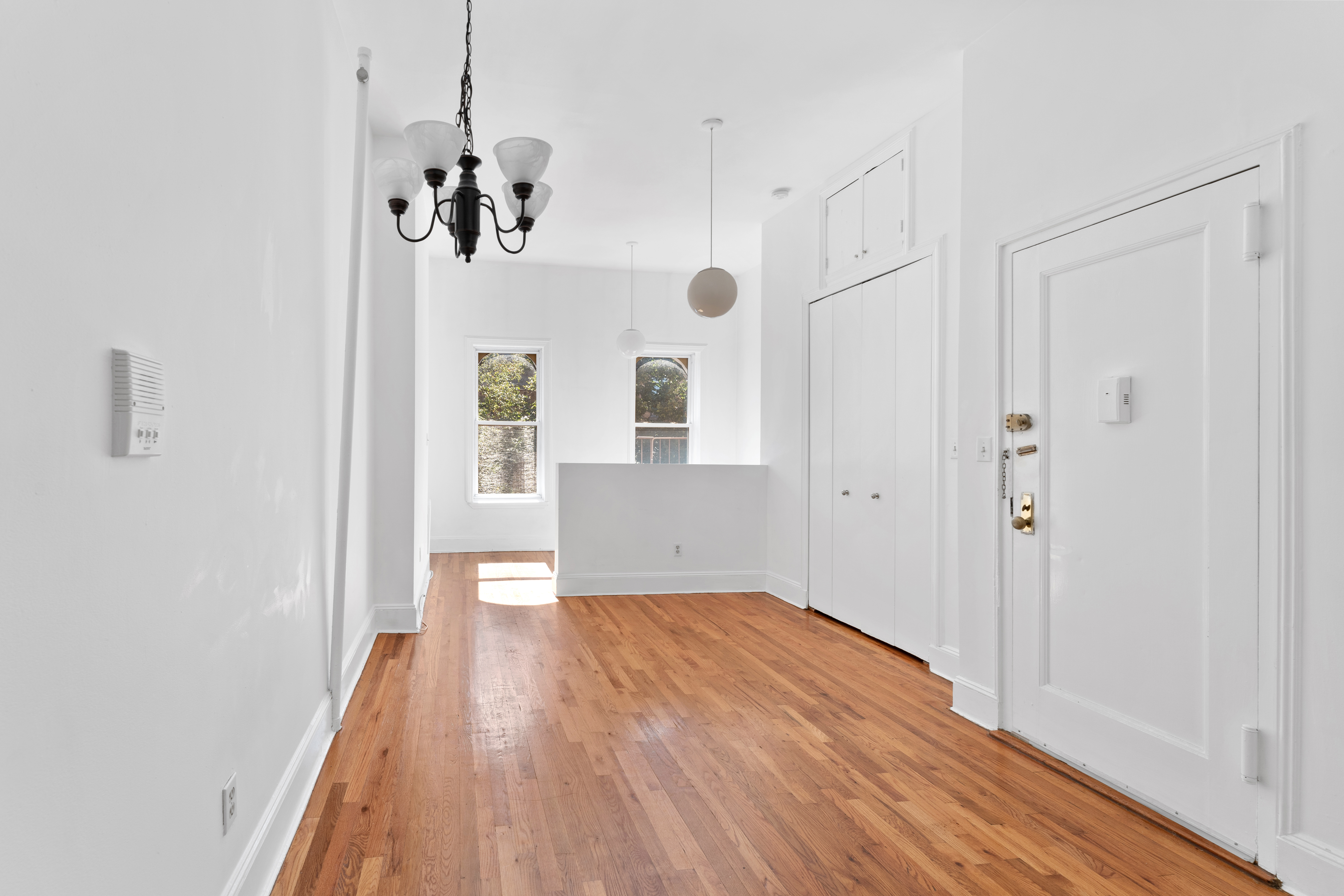 a view of a room with wooden floor