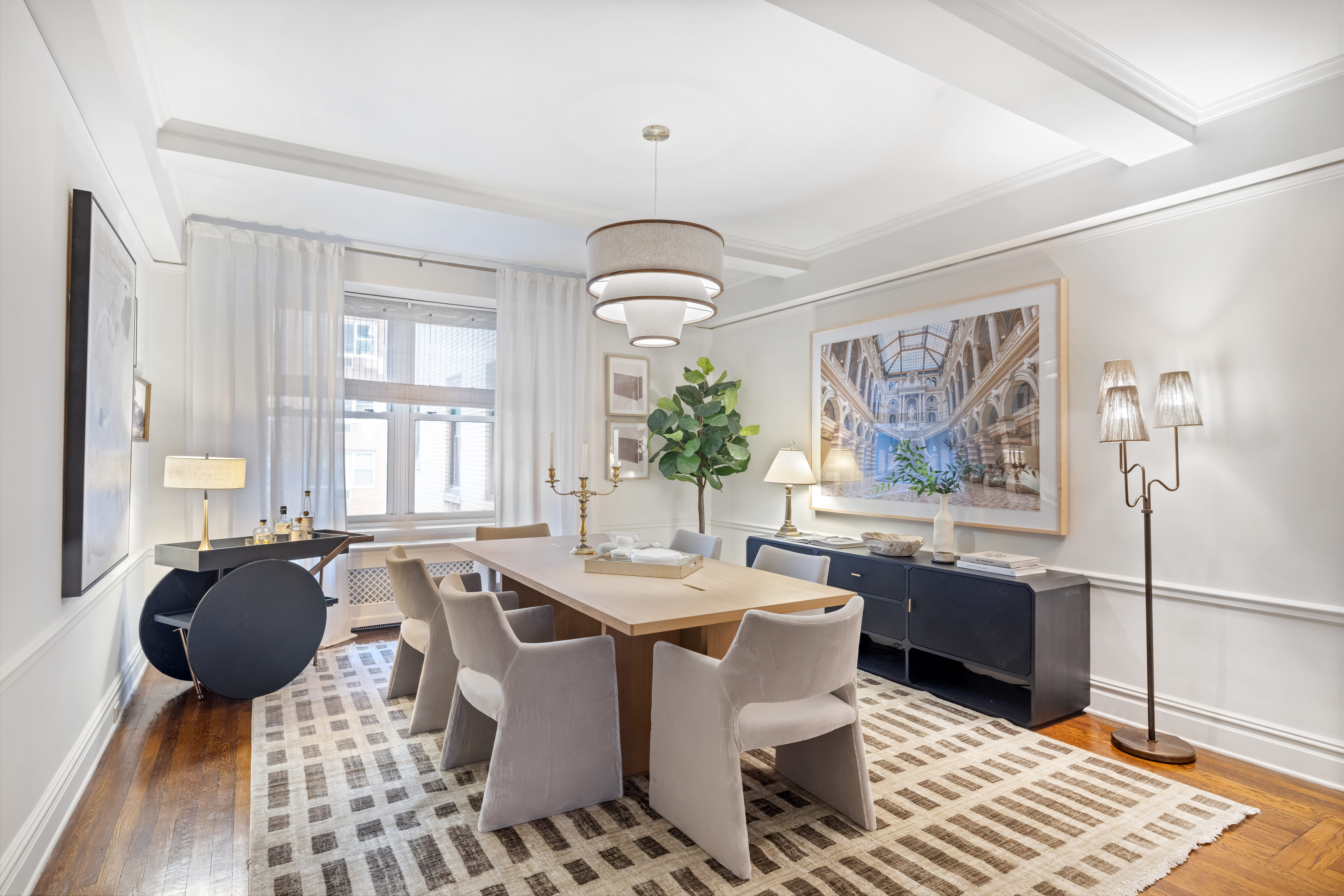 320 East 72nd Street, Unit 5B Manhattan, NY 10021 - Photo 3 of 18 a view of a dining room with furniture window and wooden floor
