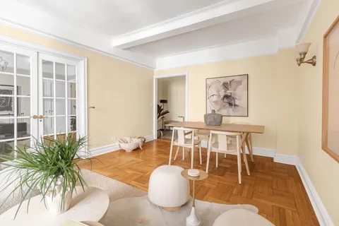 a living room with furniture and a table