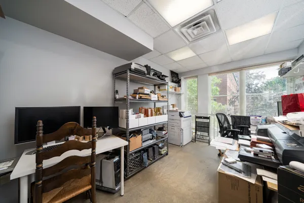 a view of a workspace with furniture