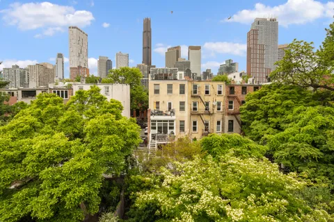 a view of a city with tall buildings