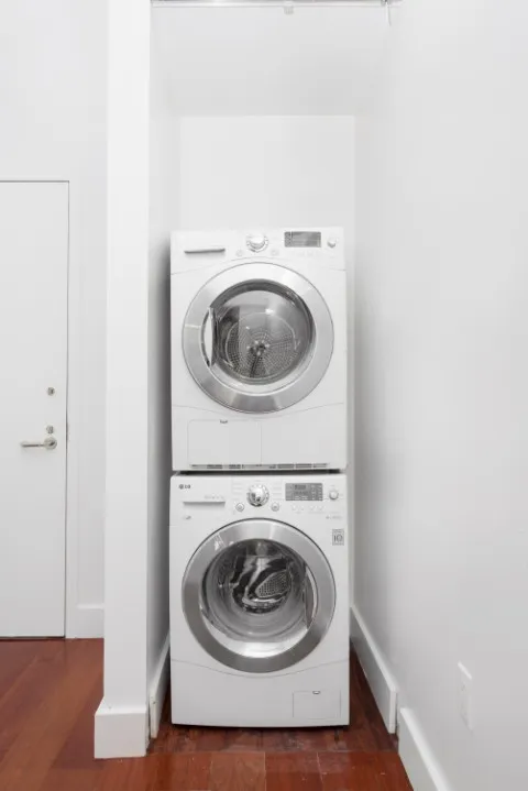 a utility room with washing machine